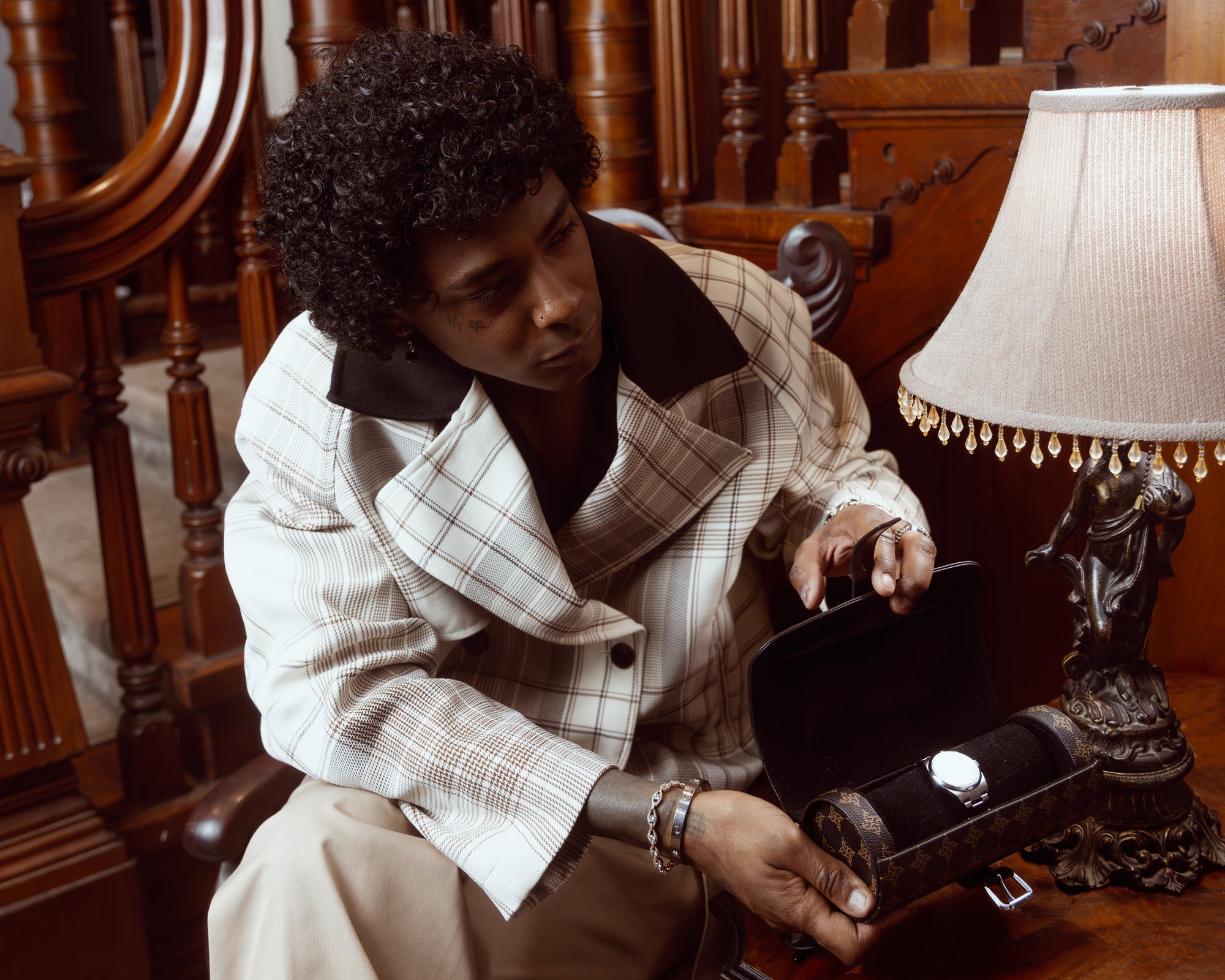 Luxury leather watch storage case open showing velvet interior compartments